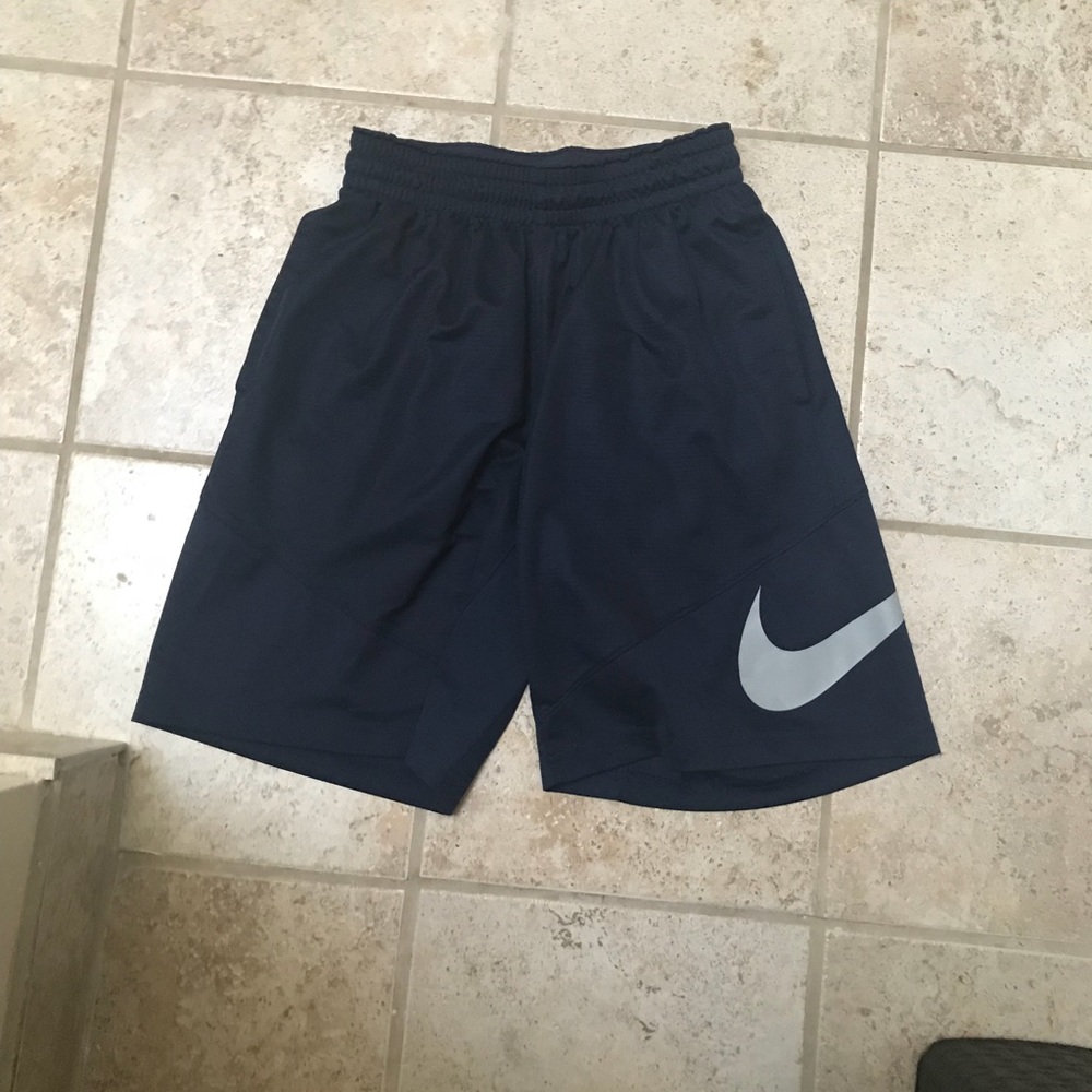 Navy blue Nike shorts with gray swoosh